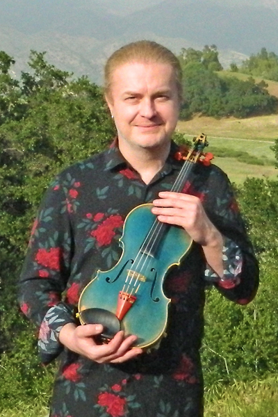 Pavel Šporcl and his Blue Violin. Photo taken at the reception on the patio after his April 10, 2022 performance. Photo by Christine Gregory